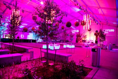 Large floral spheres, designed by Party Barbara Co. and created by Emblem, hung at varying heights from the ceiling of the tent.