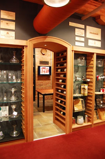 The cellar, just off the main retail showroom, is accessed through an archway flanked by a display of bottles.