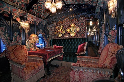 Both of the parlors on the Tequila Express are adorned with fabric-covered walls and intricate woodwork.