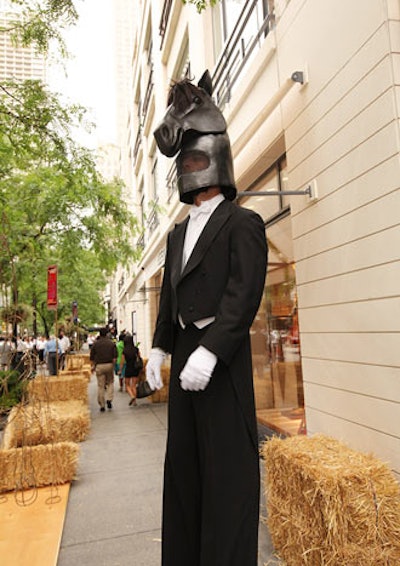 Outside the store, Redmoon performers dressed as stilt-walking horses in custom Hermès suits flown in from New York and fitted on site.