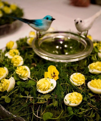 For a spring-themed event, New York's Canard Inc. turned an upside-down cake stand into a birdbath filled with greens and deviled eggs.