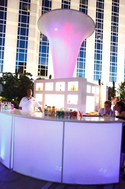 An illuminated bar popped at the nighttime event.