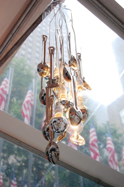 As a subtle nod to the benefit's silver anniversary, the Rockwell Group created chandeliers from silver spoons and hung the pieces overhead.