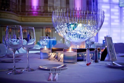 Floating candles topped the round tables, where futuristic bowls held glowing LED lights.