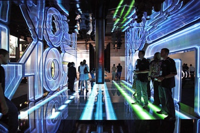 Disney Interactive Studios contracted Greco Decor for art direction and booth production for its exhibit, designed to highlight titles such as Tron: Evolution, Disney Epic Mickey, Toy Story 3, and Pirates of the Caribbean: Armada of the Damned.