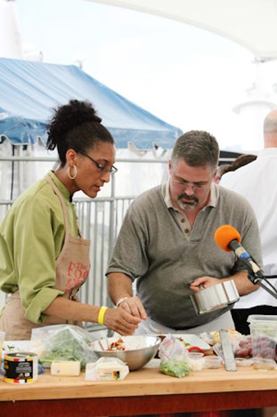 Top Chef finalist Carla Hall cooked with a festival attendee during the 'Tap Your Inner Toque' chef cook-along tournament.