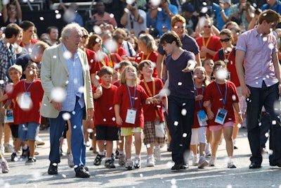 Harry Potter stars including Daniel Radcliffe brought the first guests into the park on Friday morning.