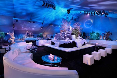 Alpine foliage and white seating gave the party tent a snowy feel.
