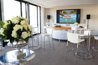 White furnishings filled the party areas on the fifth floor, where guests could view the show from a small balcony overlooking the stage.