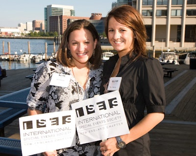 ISES New England volunteers directed guests down the New England Aquarium boardwalk to the outdoor cocktail hour overlooking sailboats in Boston Harbor.