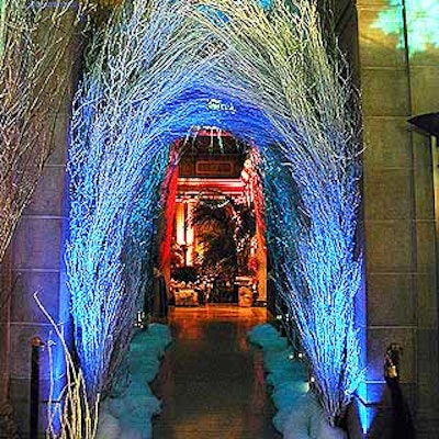 For the Young Fellows of the Frick Collection's F?te des Quatre Saisons benefit gala, Ron Wendt of Ron Wendt Designs and Robert Rufino of Tiffany and Company decorated the museum entrance with a winter theme, which included an arch of 15-foot-tall cherry and birch tree branches lit by rich blue lights from Frost Lighting.