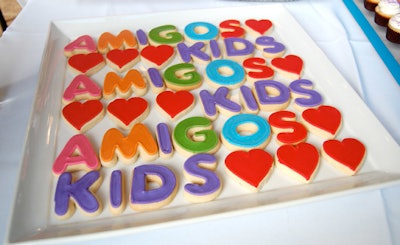 Golosinas served iced cookies spelling out the charity's name.