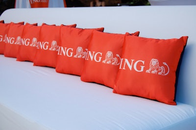 Pillows with ING logos adorned sofas in the lounge area of the pavilion and upper terrace outside the Treetop Ballroom.