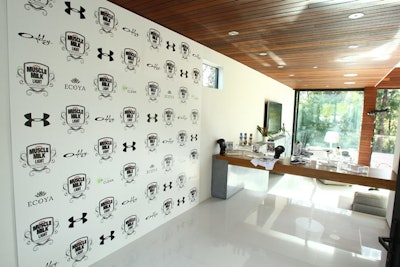 Logos covered a wall in the house, which generally maintained an understated look, free from heavy branding.