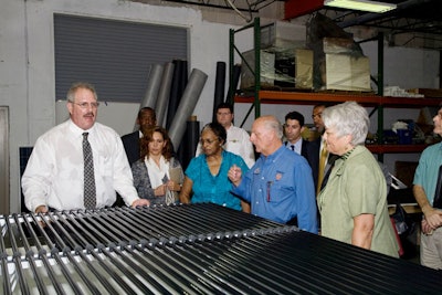 Advanced Green Technologies president Rob Kornahrens gave attendees a tour of the facilities, explaining the differences between the various types of solar panels.