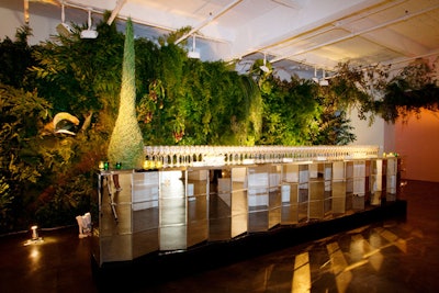 At the entrance to the dinner set up at the Phillips de Pury & Company gallery, Van Wyck & Van Wyck built an enormous wall of foliage. To connect the many rooms of the space, a vertical garden started at this wall and extended throughout the venue.