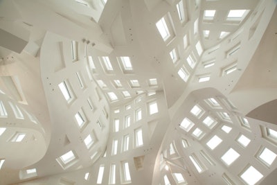 Frank Gehry, known for his unusual and curvilinear shapes, designed the space.