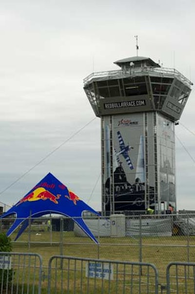 Built by crane, anchored by 30,000 liters of water, and housing five functioning floors, the 75-foot Red Bull race tower travels from city to city.