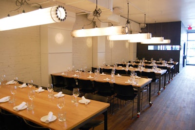 The dining area features eight oak veneer-topped communal tables lit by Castor's recycled tube lights—a fixture at sister restaurant OddFellows.