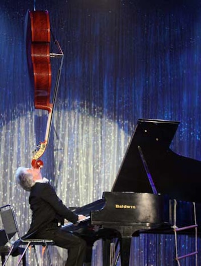 Mitchell Zeidwig performed piano feats.