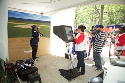 In addition to a balloon sculptor and face painters, the dugout drew crowds with a photo booth.