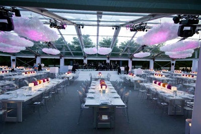 The tent also housed 40 custom white lacquer dinner tables, clear Lucite chairs, and a white lacquer dance floor. Cartier underwrote the programs that guests found on their chairs.