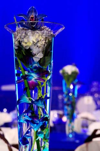 Concept Flowers decorated the tables with centerpieces of blue orchids and hydrangeas in tall clear vases.