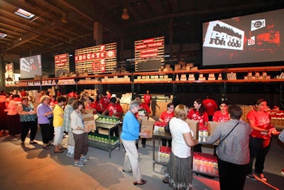 Attendees made their way through the meal kit assembly line at either end of the venue. One guests noted that at some point during the evening, the lines for these stations stretched longer than the lines for the buffet.