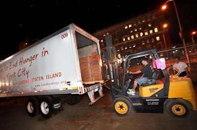 After guests packed the kits, Target volunteers taped the boxes, packed several onto pallets, and lifted them onto Food Bank for New York City trucks.