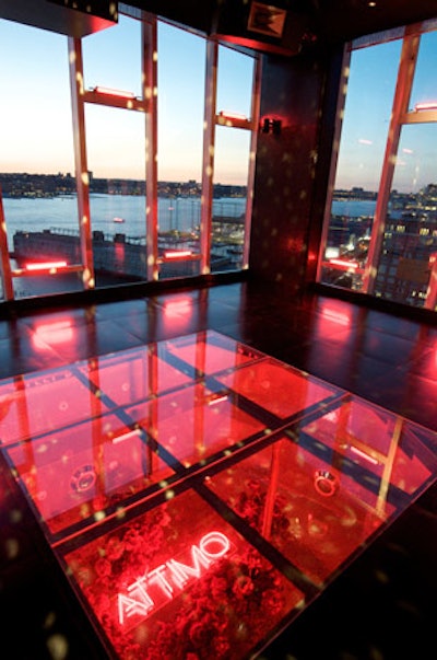 Peppered with references to Attimo's packaging, Ferragamo's launch event was set with red peony bouquets, gold-mirrored side tables, and neon red lighting.