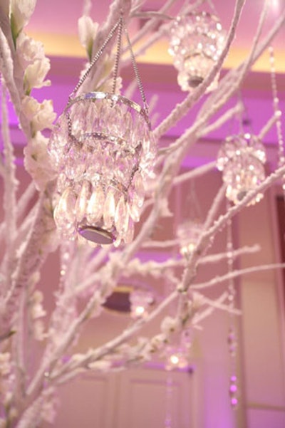 Edge Floral Event Designers incorporated small glass lanterns into it's 'Snow Queen' tabletop.