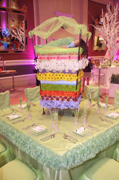 Gloria Rhodes and Capital Party Rentals created a tower of flower mattresses as the centerpiece on its 'Princess and the Pea' table.