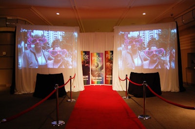 Two screens broadcasting footage from past Pride events flanked the red carpet at the entrance to the gala.