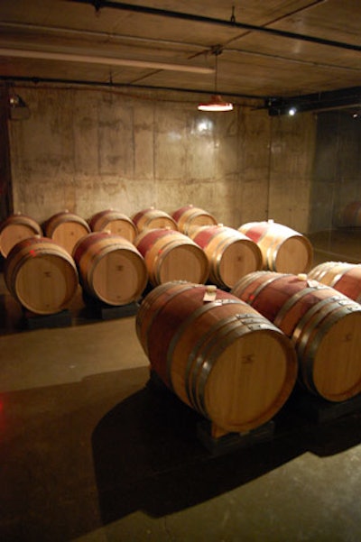 French, Hungarian, and American oak barrels line the walls of the barrel room.