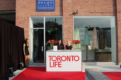 A red carpet and a guest registration desk sat at the entrance to the Andrew Richard Designs venue on Adelaide Street East.