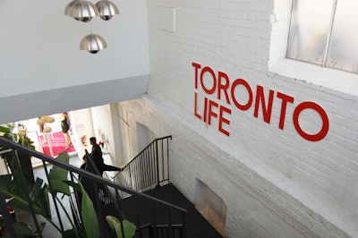 A Toronto Life logo decorated the wall in the stairway leading up to the party space.