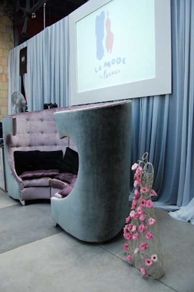 A curved sofa from Chair Source provided seating for guests.