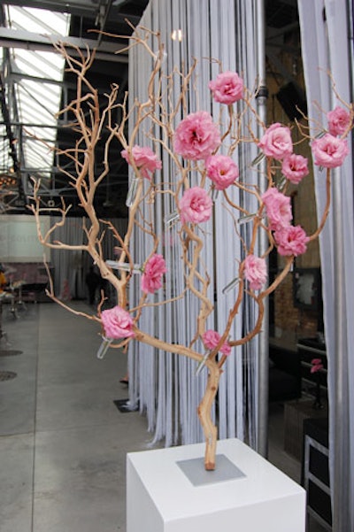 Pink floral arrangements flanked either side of the entrance to the venue.