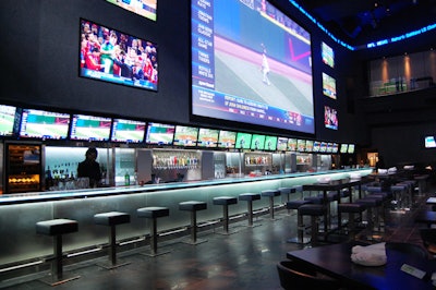 The main space, dubbed the Arena, features an 80-foot bar, a massive HD screen, and seating for 220.