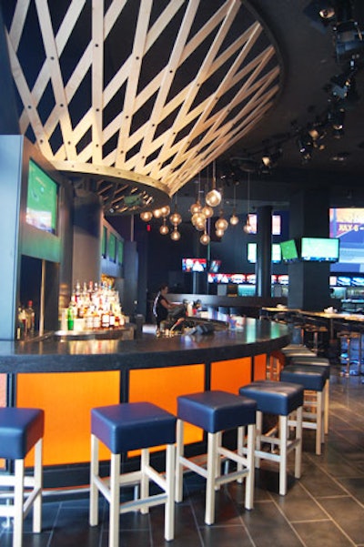 Inspired by basketball, the Tip Off Bar has an orange bar and an installation resembling a basketball net.