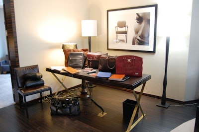A collection of leather goods from designer Carina Black, including iPad covers and clutch purses, sat on a desk in the suite.