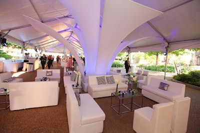 Ronsley gave the cocktail tent a sleek white look inspired by downtown venues. Zebra-striped pillows nodded to some of the zoo's inhabitants.