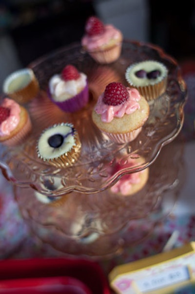 Local boutique clothing store Sweets served colorful mini cupcakes outside its establishment.