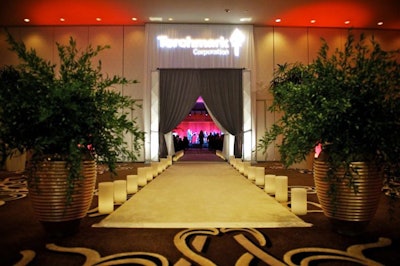 A white carpet lined with candles led the way into the ballroom for the award dinners.