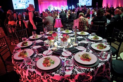 Black-and-white damask table linens were accented by black satin napkins and seat cushions.