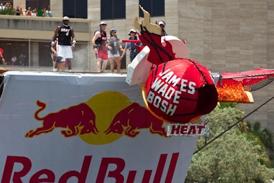 In honor of Dwyane Wade, Chris Bosh, and LeBron James signing with the Miami Heat, Team Heat showcased the player's names on their fireball-shaped flying machine.