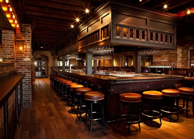 Anchoring the bar area is a freestanding 25-seat wooden bar that features overhead Scotch lockers for rent.