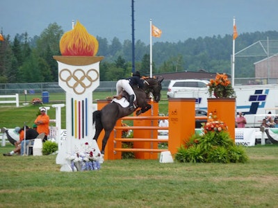 Hermés, the Grand Prix Sponsor at the Lake Placid Horse Show, even brings its own jumps. Check out the matching flowers.
