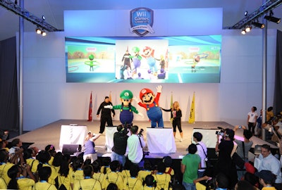 Nintendo launched Friday's festivities with a procession led by Olympic gymnast Shawn Johnson and actors in Mario and Luigi costumes. The iconic Nintendo characters took to the stage to welcome participating teams with a Wii Fit Plus Hula-hoop challenge.