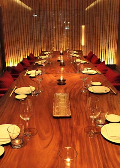 The private dining room can seat 18 at a long wooden table surrounded by plush armchairs.